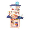 A children's play kitchen toy by Hidden Gems, featuring a beige and navy blue design with various colorful food and kitchen accessories, shown on a plain white background with a brand logo overlay in the top left.